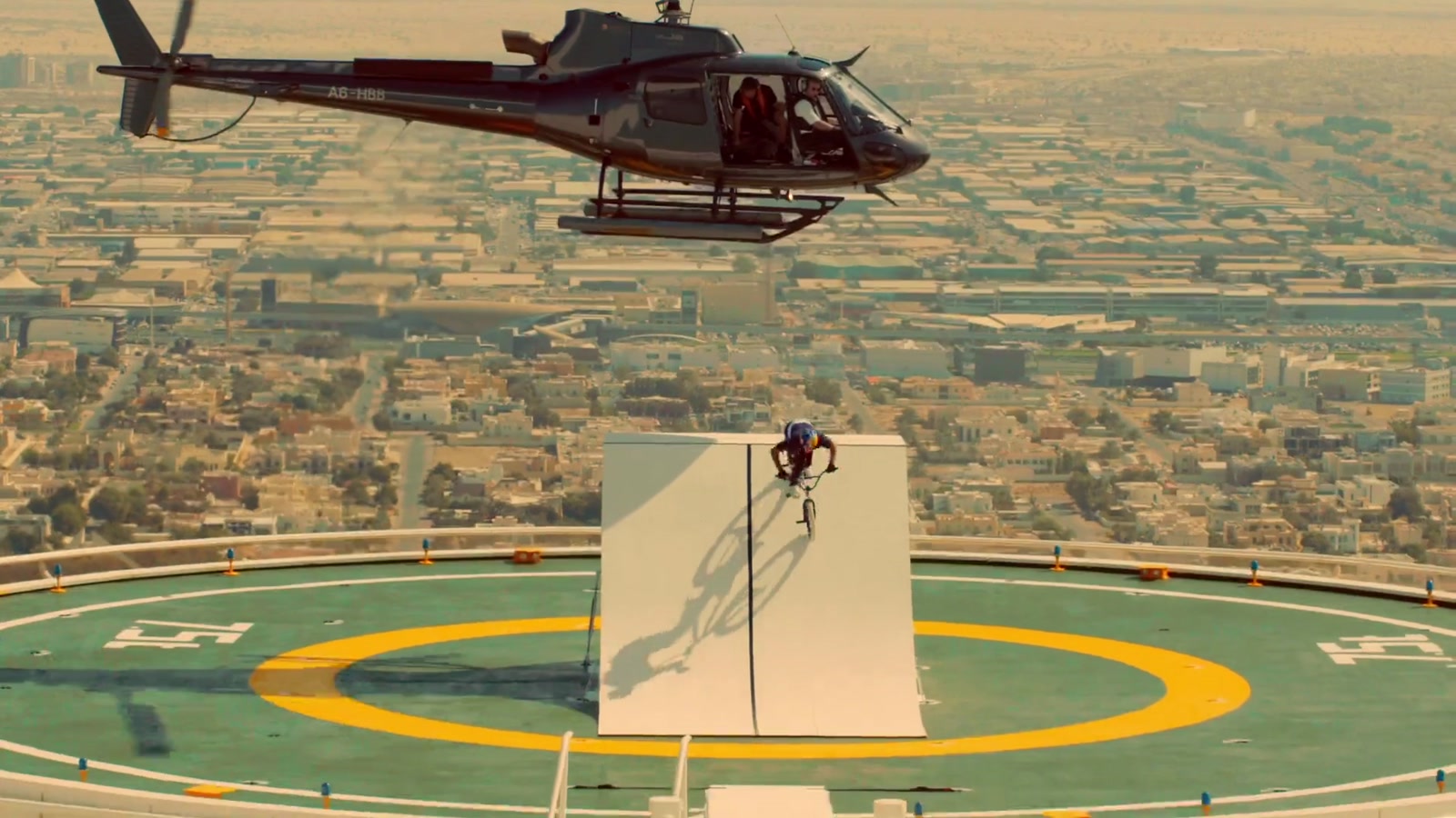 Kriss Kyle jumps with his BMX from a helicopter towards the Burj Al Arab helipad in Dubai, United Arab Emirates.