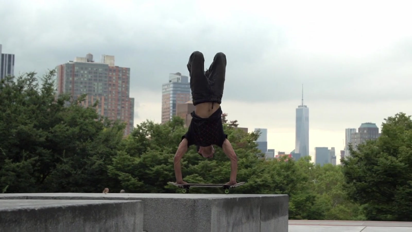 Kilian Martin balances in an inverted freestyle skateboard move in New York City, United States.