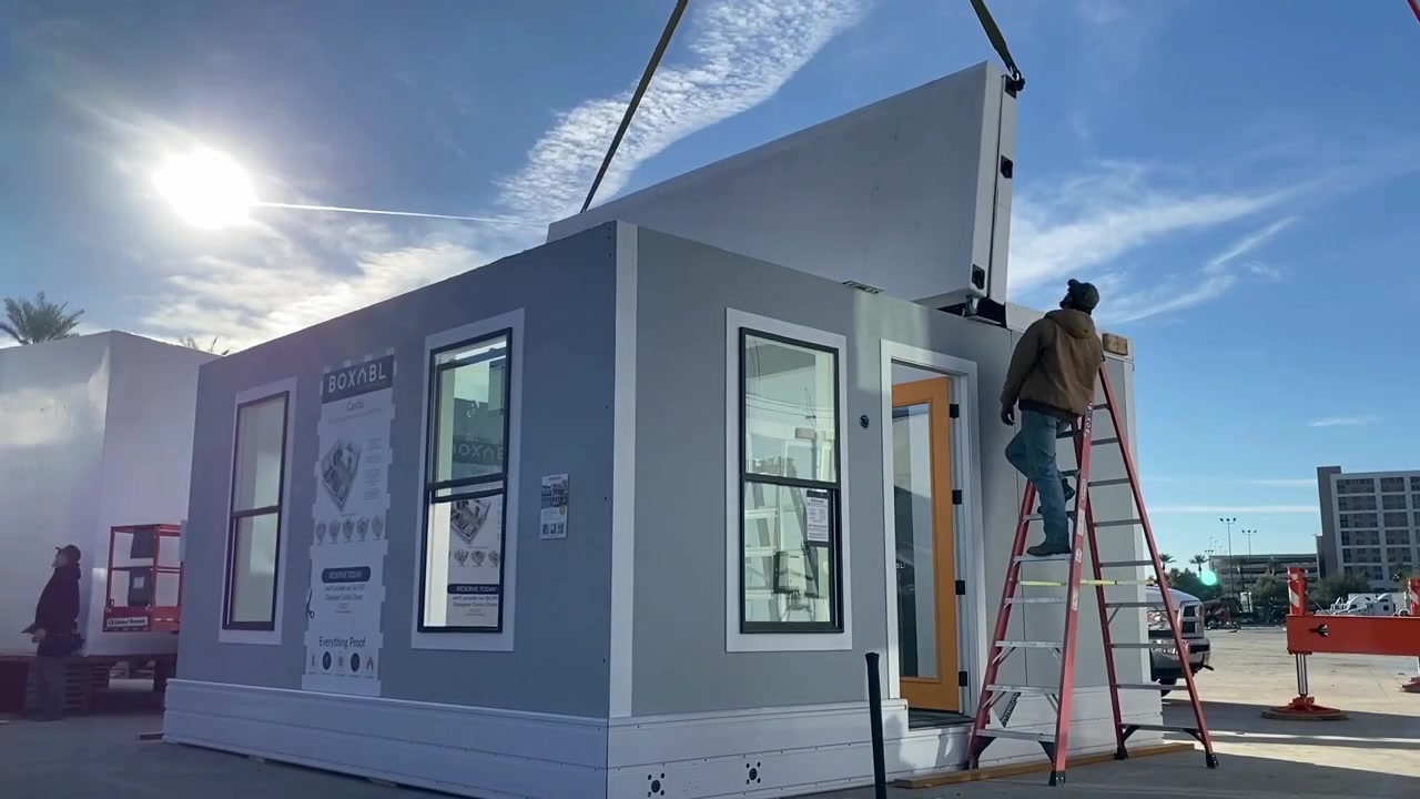 Workers unfolding the walls of a BOXABL Casita during installation