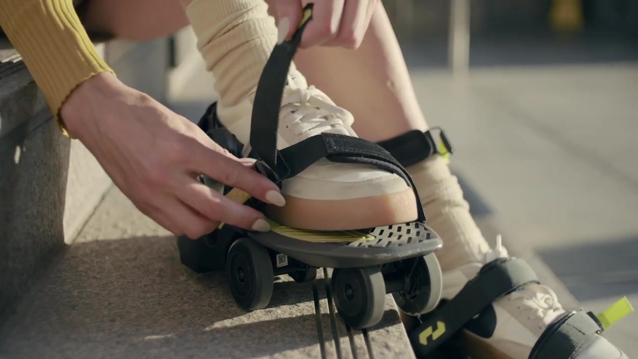 A close-up of Shift Robotics Moonwalkers strapped over ordinary shoes.