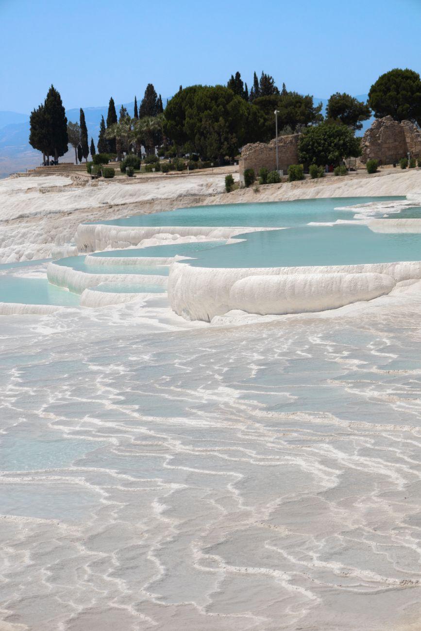 White travertine terraces holding turquoise pools at Pamukkale